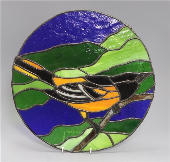 A 1970s stained glass panel depicting a Baltimore Oriole diameter 35cm